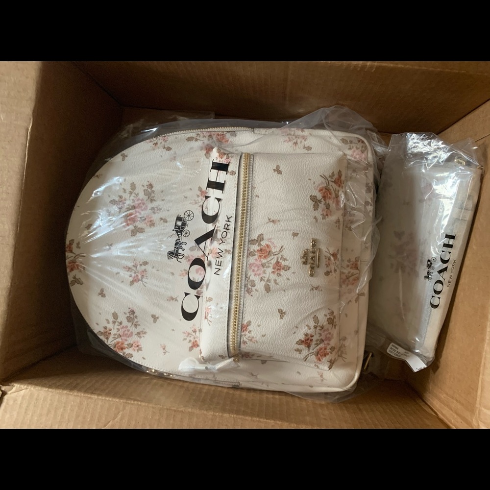 *SOLD* leather white floral Coach backpack
